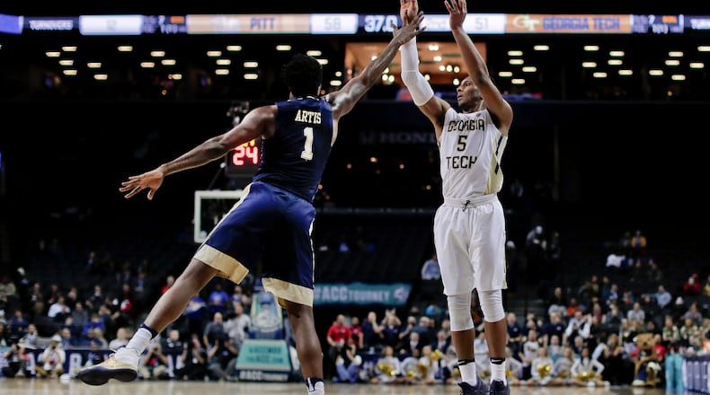 Georgia Tech guard Josh Okogie (5) puts up a shot against Pittsburgh forward Jamel Artis (1) during the second half of an NCAA college basketball game in the first round of the ACC tournament, Tuesday, March 7, 2017, in New York. Pittsburgh won 61-59. (AP Photo/Julie Jacobson)