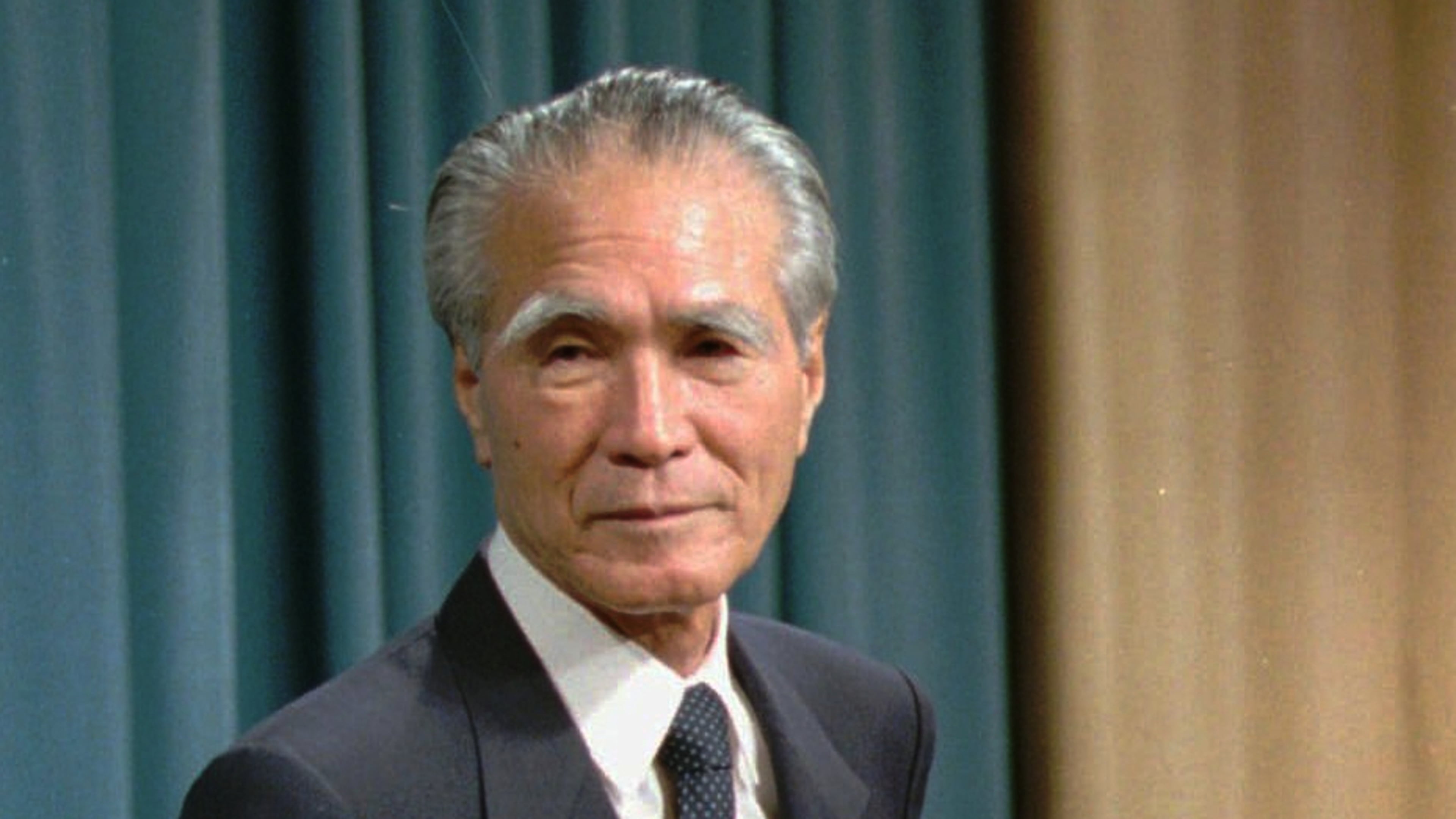 FILE - Japanese Prime Minister Tomiichi Murayama stands before reporters prior to his statement of war remorse at the prime minister's official residence in Tokyo, Aug. 15, 1995. (AP Photo/Naokazu Oinuma, File)