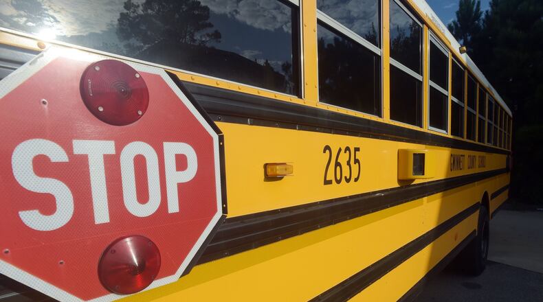A Gwinnett County school bus with a video camera. KENT D. JOHNSON/KDJOHNSON@AJC.COM