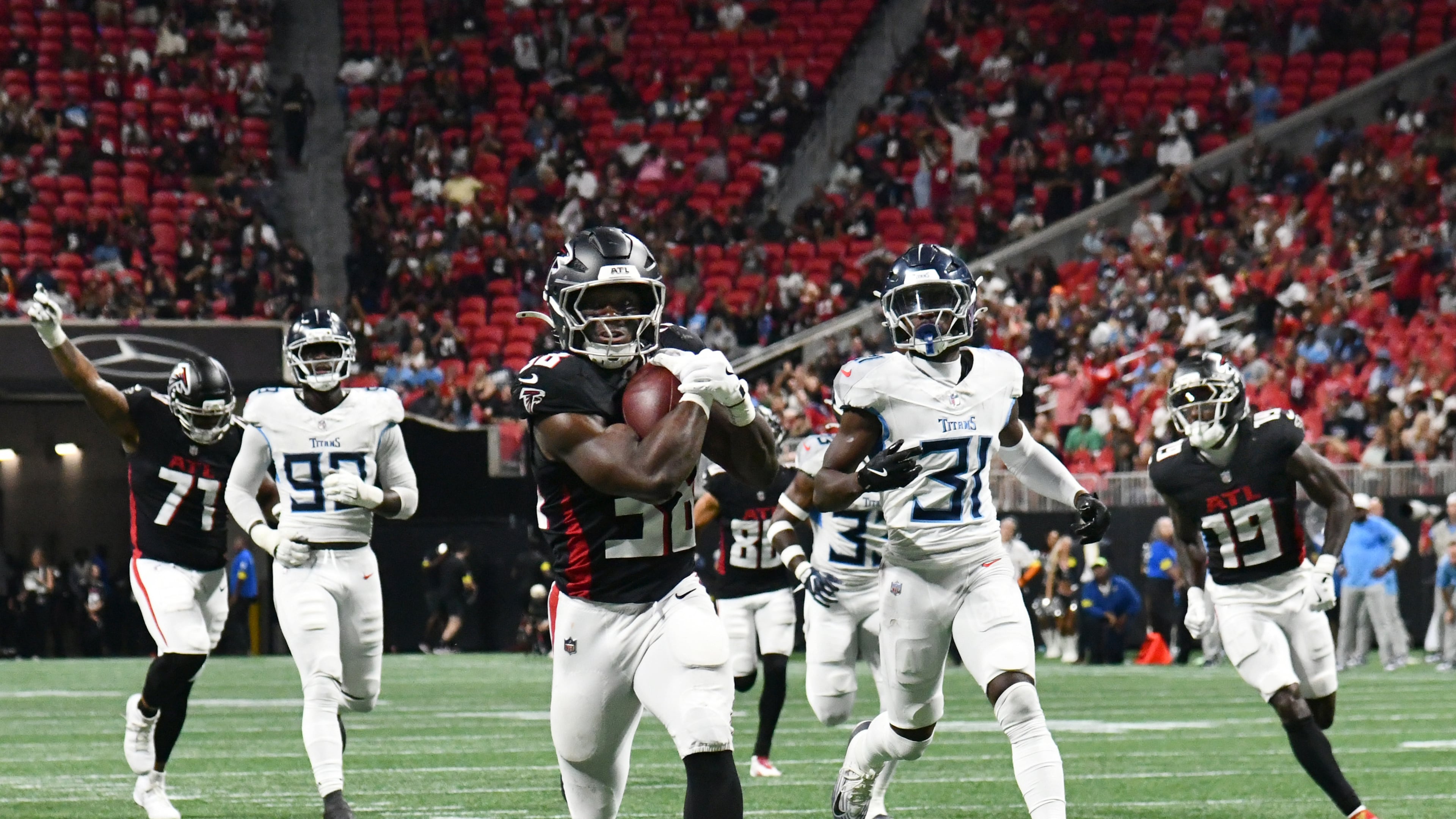 Atlanta Falcons running back Nathan Carter (38) runs for a touchdown during the second half of an NFL preseason game at Mercedes-Benz Stadium, Friday, August 15, 2025, in Atlanta. Tennessee Titans won 23-20 over Atlanta Falcons. (Hyosub Shin / AJC)