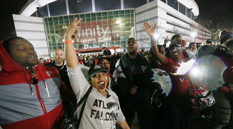 JANUARY 22, 2017 ATLANTA Atlanta Falcons fans brave the weather outside the Georgia Dome as they celebrate the win over the Green Bay Packers 44-21 in the NFL football NFC Championship game on Sunday, Jan. 22, 2017. Bob Andres/BANDRES@AJC.COM