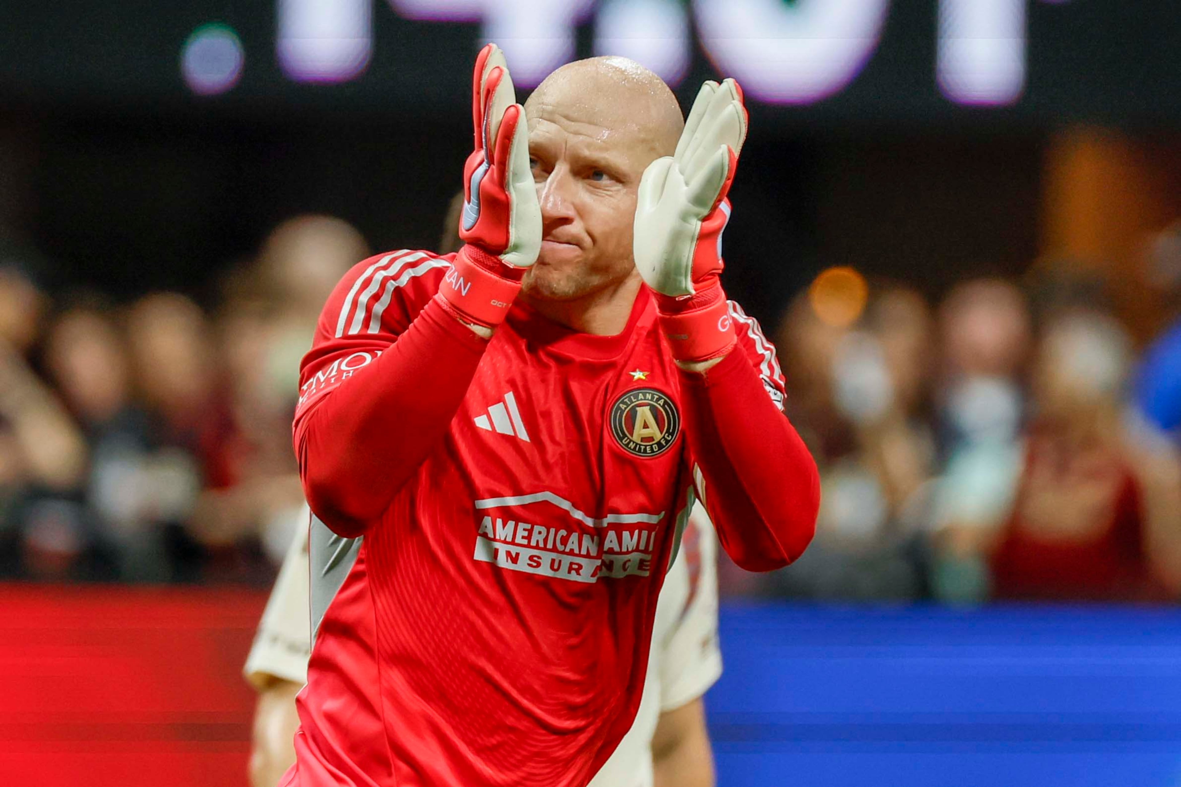 Atlanta United goalkeeper Brad Guzan (1) applauds toward the Atlanta United supporters at the end of the first half at Mercedes-Benz Stadium on October 18, 2025, in Atlanta, Ga. (Miguel Martinez/ AJC)