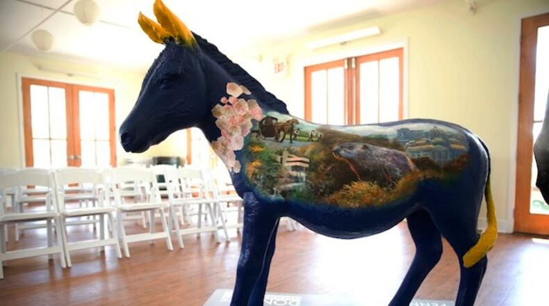 An example of one of dozens of fiberglass donkeys that will be positioned around the city ahead of the Democratic National Convention is shown, Tuesday, April 19, 2016, in Philadelphia. Fifty-seven of the painted donkeys, representing each U.S. state, territory, Washington, D.C., and Democrats Abroad will be displayed from July 1 to Sept. 5 throughout Center City, where most convention events outside the Wells Fargo Center are to take place. Local artists will paint them with iconic images from each location. (AP Photo/Matt Rourke)