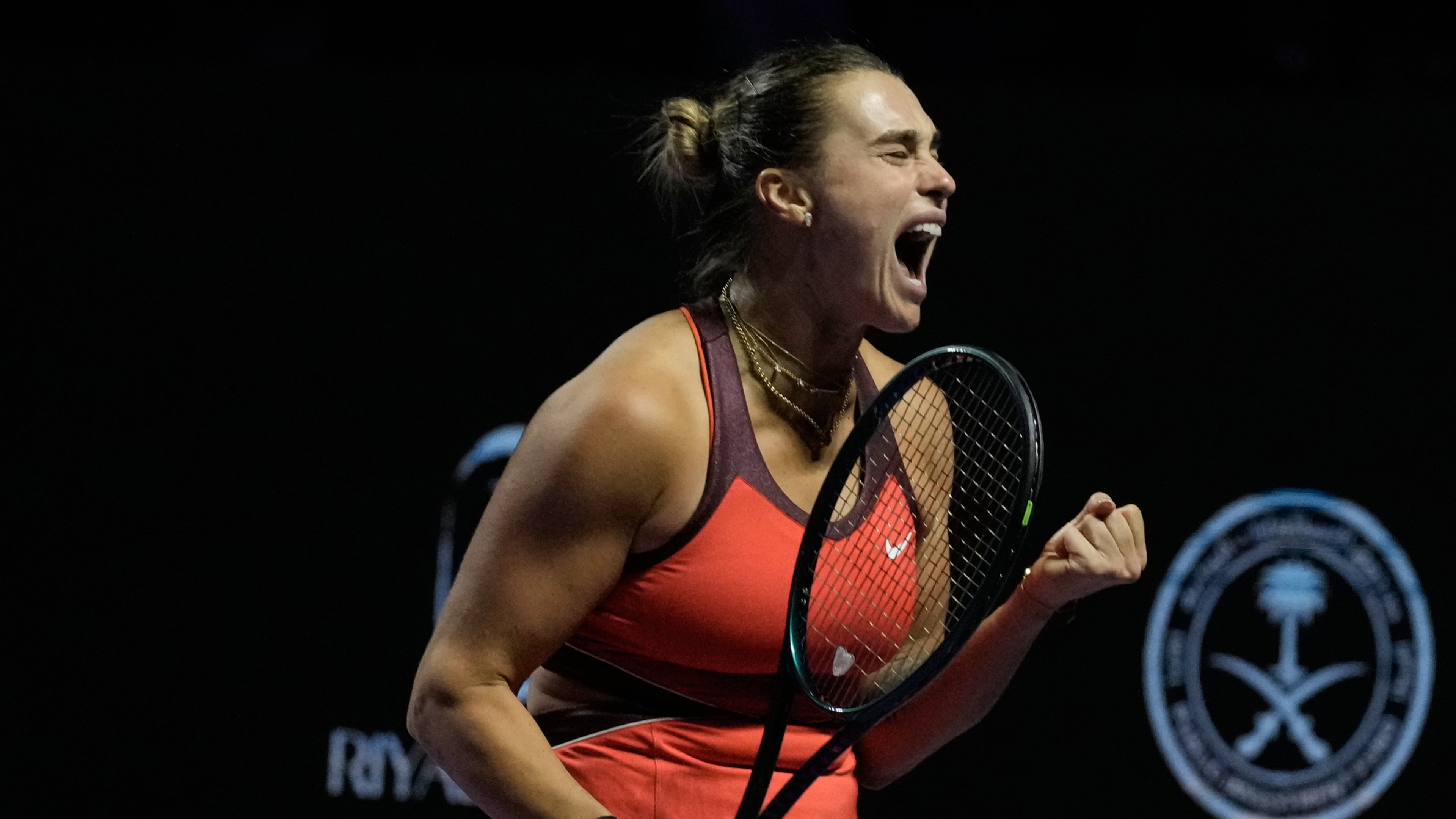 Aryna Sabalenka of Belarus celebrates after winning a point against Amanda Anisimova of the United States during their women's singles semifinal match at the WTA tennis finals in Riyadh, Saudi Arabia, Friday, Nov. 7, 2025. (AP Photo/Fatima Shbair)