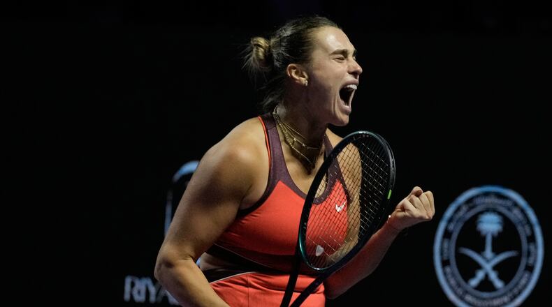 Aryna Sabalenka of Belarus celebrates after winning a point against Amanda Anisimova of the United States during their women's singles semifinal match at the WTA tennis finals in Riyadh, Saudi Arabia, Friday, Nov. 7, 2025. (AP Photo/Fatima Shbair)
