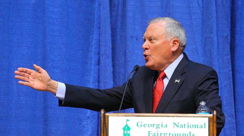 100714 PERRY: Governor Nathan Deal makes a point while answering a question during the gubernatorial debate in Reaves Arena at the Georgia National Fair on Tuesday, Oct. 7, 2014, in Perry. CURTIS COMPTON / CCOMPTON@AJC.COM Nathan Deal, the Republican incumbent, makes a point while answering a question during the debate for governor in Reaves Arena at the Georgia National Fair on Tuesday in Perry. Curtis Compton, ccompton@ajc.com