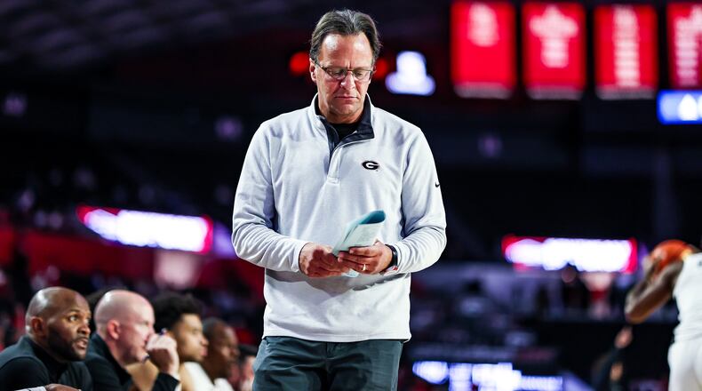 Georgia head coach Tom Crean looks at his notes during a game against FIU at Stegeman Coliseum in Athens on Tuesday, Nov. 9, 2021. (Photo by Tony Walsh/UGA Athletics)