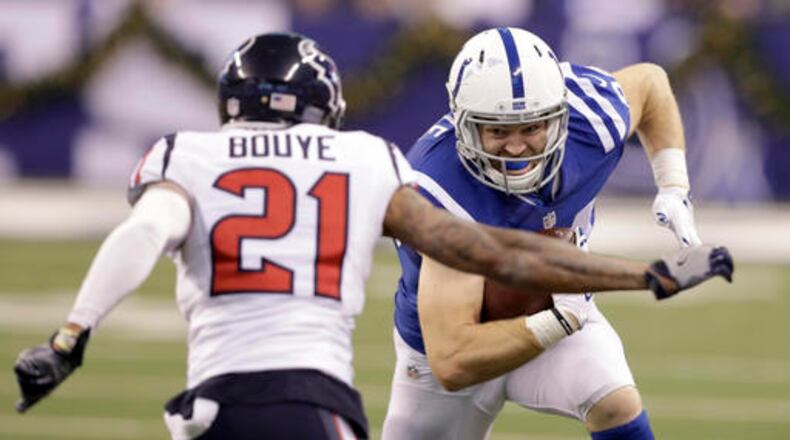 Indianapolis Colts tight end Jack Doyle, right, is stopped by Houston Texans cornerback A.J. Bouye after catching a pass during the first half of an NFL football game Sunday, Dec. 11, 2016, in Indianapolis. (AP Photo/Darron Cummings)