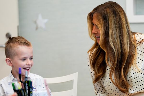 First lady Melania Trump talks with a boy while visiting Children's National Hospital, Thursday, July 3, 2025, in Washington. (AP Photo/Julia Demaree Nikhinson)