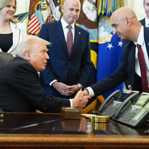 President Donald Trump, left, shakes the hand of Novo Nordisk President and CEO Mike Doustdar during an event about drug prices, Thursday, Nov. 6, 2025, in the Oval Office of the White House in Washington. (AP Photo/Evan Vucci)
