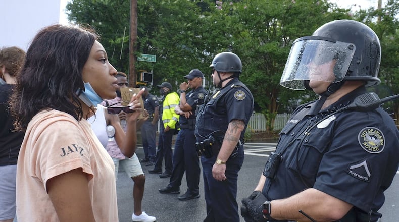 Protesters march from Wendy's to a police precinct at Grant Park on Sunday, June 14, 2020. On Saturday, protesters set fire to the Atlanta Wendy's where Rayshard Brooks, a 27-year-old black man, was shot and killed by Atlanta police Friday evening during a struggle in the Wendy's parking lot. (Photo: Ben Gray for The Atlanta Journal-Constitution)