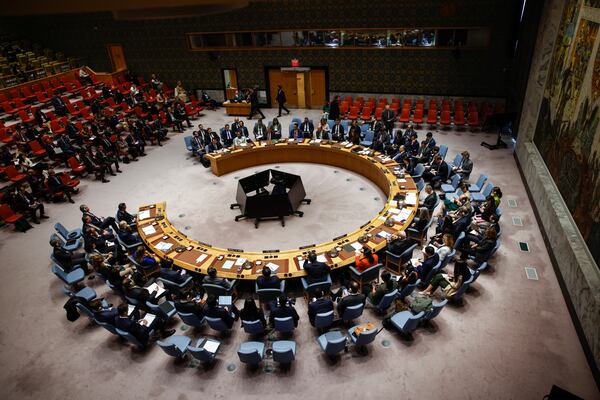 Syria's Foreign Minister Asaad Al-Shibani, left, speaks as he attends a Security Council meeting on the situation of the Middle East at United Nations Headquarters on Friday, April 25, 2025. (AP Photo/Kena Betancur)