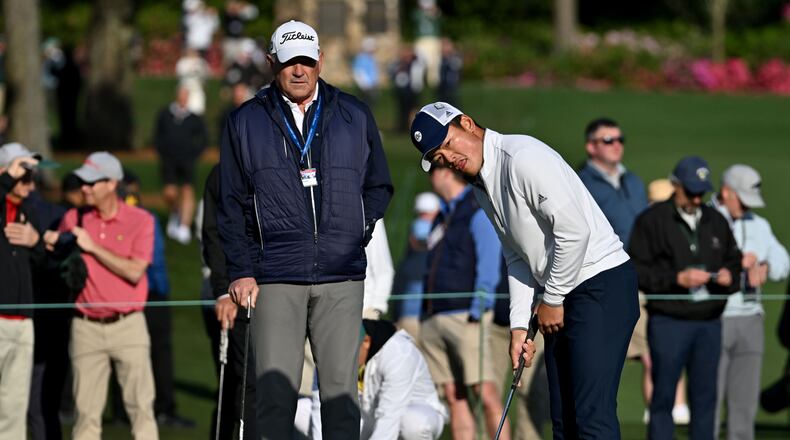 Georgia Tech assistant golf coach Jeff Paton watches as Hiroshi Tai prepares to play a shot on the practice range at Augusta National Golf Club, Wednesday, April 9, 2025, in Augusta. (Hyosub Shin / AJC)