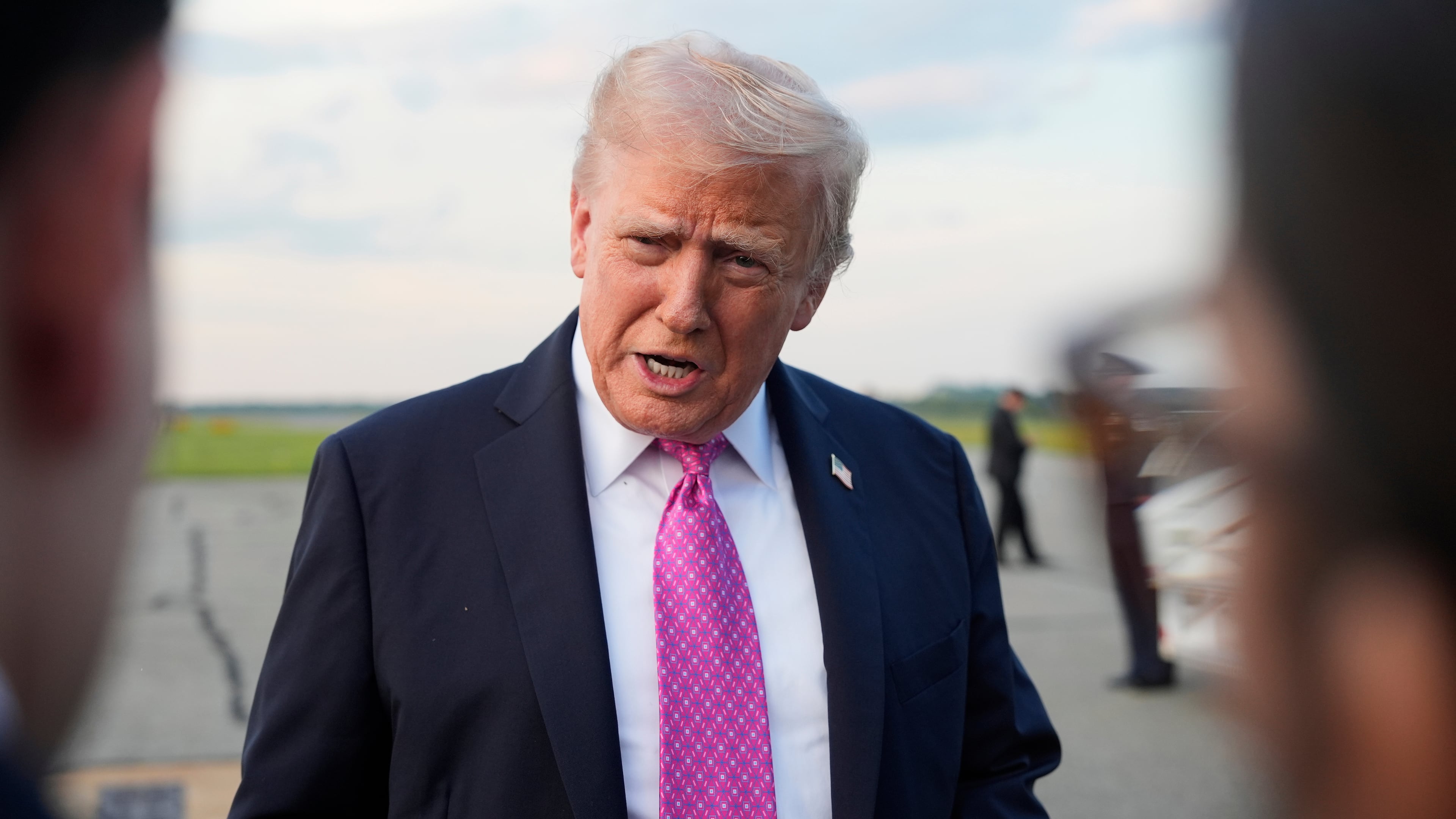 President Donald Trump speaks with reporters before boarding Air Force One at Morristown Airport, Sunday, Sept. 14, 2025, in Morristown, N.J. (AP Photo/Alex Brandon)