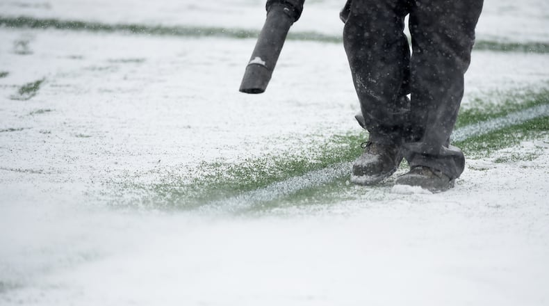MINNEAPOLIS, MN - MARCH 12: A crew member melts the snow on the lines during a break in the action in the first half of the match between the Minnesota United FC and the Atlanta United FC on March 12, 2017 at TCF Bank Stadium in Minneapolis, Minnesota. (Photo by Hannah Foslien/Getty Images)