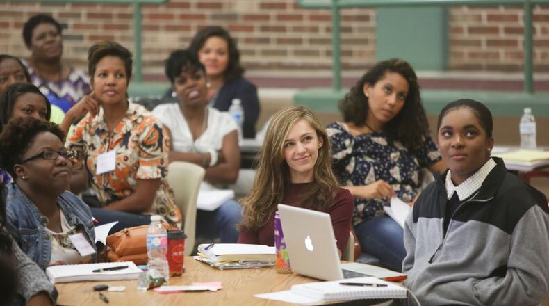 Staff attend a training session at Thomasville Heights Elementary School this summer. EMILY JENKINS/ EJENKINS@AJC.COM