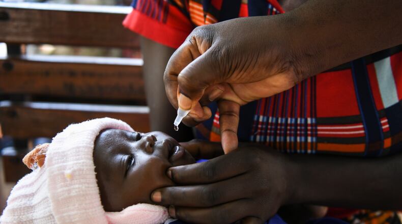 Charles Bizimaki administers a polio vaccine at the Makhwira Health Center in Chikwawa, Malawi. Dr. Jonas Salk developed the world’s first safe and effective polio vaccine. (Thoko Chikondi/The New York Times 2022)