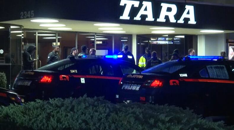 The guard shot the liquor store thief Wednesday night, but the injured man was not found until hours later, police said. He was sitting in a Cheshire Bridge Road movie theater.