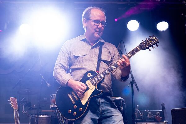 Retired federal judge and mediator Clay Fuller plays lead guitar with Allgood during a show in Roswell on Saturday, April 11, 2026. (Ben Gray for the AJC)