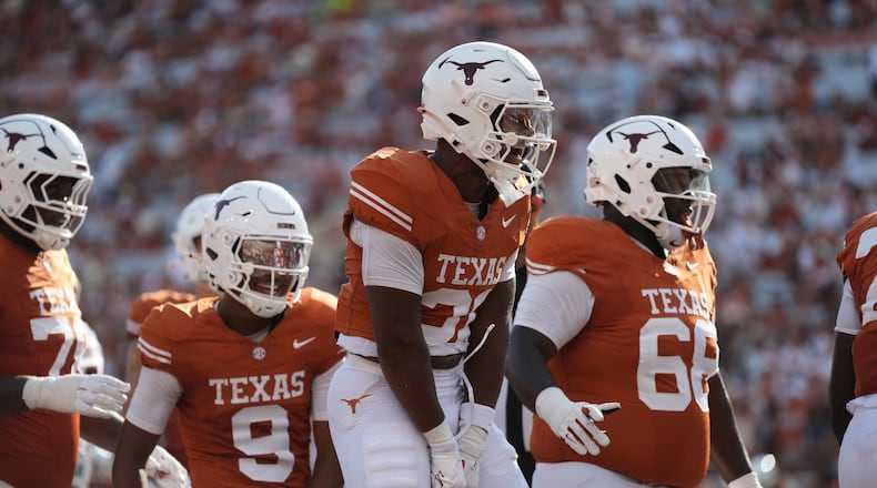 Texas running back James Simon (31) celebrates with teammates after scoring a touchdown against Texas State during the second half of an NCAA college football game in Austin, Texas, Saturday, Sept. 5, 2026. (AP Photo/Eric Gay)