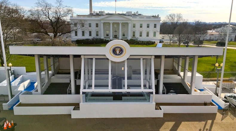 The inaugural parade presidential reviewing stand on Pennsylvania Avenue in front of the White House, Sunday, Jan. 15, 2017, is nearly completed in preparation for the 58th presidential inauguration, on Friday, Jan. 20. (AP Photo/Pablo Martinez Monsivais)