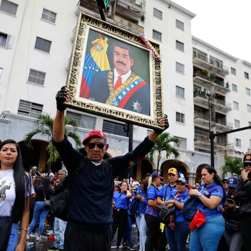 Supporters of former Venezuelan President Nicolas Maduro rally calling for his release as he faces trial in the United States after being captured by U.S. forces, in Caracas, Venezuela, Friday, Jan. 14, 2026. (AP Photo/Cristian Hernandez)