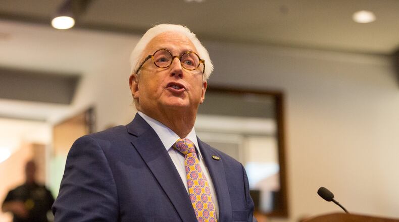 MUST Ministries President & CEO Dr Dwight “Ike” Reighard addresses the Marietta City Council during the meeting where the Council decided to grant his organization’s request to build a 130-bed new homeless shelter. PHIL SKINNER