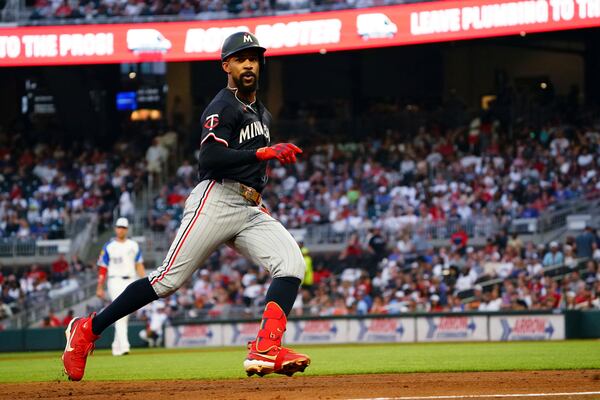 Minnesota Twins outfielder Byron Buxton (25) runs to third base on a triple against the Atlanta Braves during the third inning in a baseball game at Truist Park, Saturday, April 19, 2025, in Atlanta. (AP Photo/ John David Mercer)
