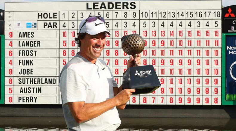 April 16, 2017, Duluth: Stephen Ames, Canada, is presented the trophy on the 18th green winning the Mitsubishi Electric Classic at TPC Sugarloaf with a 15-under par for a four stroke victory over second place finisher Bernhard Langer on Sunday, April 16, 2017, in Duluth. Curtis Compton/ccompton@ajc.com