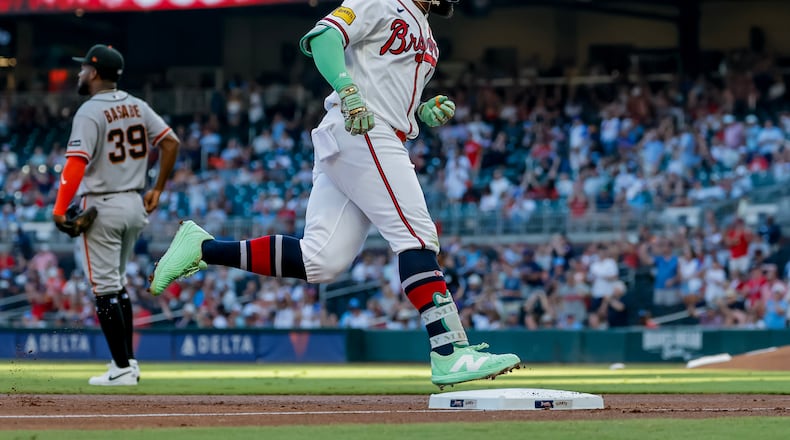 Atlanta Braves' Michael Harris II, right, rounds the bases after hitting a solo home run against the San Francisco Giants during the second inning of a baseball game, Monday, Aug. 31, 2026, in Atlanta. (AP Photo/Erik S. Lesser)