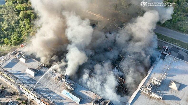 In this photo provided by the Ukrainian Military administration, firefighters work on a fire at a shopping mall following a Russian drone attack in Kryvyi Rih, Ukraine, Friday, Aug. 21, 2026. (Ukrainian Military administration via AP)