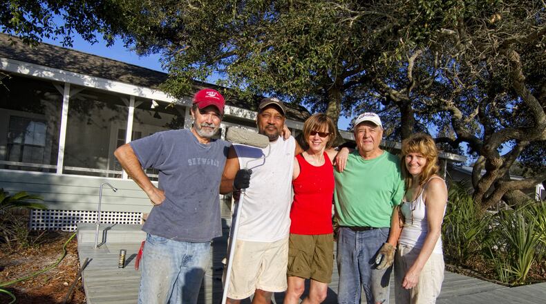 Billy Howard and Laurie Shock joined with friends and family to buy and renovate a 100-year-old home near Mexico Beach in Florida. Pictured in the photo, right to left are Shock, her father Mike Shock, Pam Wuichet, J.D. Scott and Howard. SPECIAL