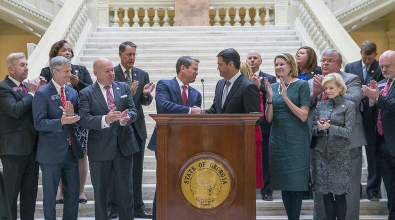 Georgia Lt. Gov. Geoff Duncan (right) shakes Gov. Brian Kemp’s hand after introducing him during a press conference at the State Capitol Nov. 4, 2019. Gov. Kemp announced a proposed limited expansion of Medicaid in Georgia. (Alyssa Pointer/Atlanta Journal-Constitution)