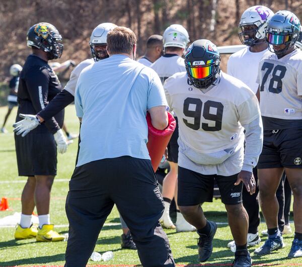 Fan Controlled Football professional Donte Rumph #99, right, runs drills during practice March 4, 2021.  The FCF is in the middle of its first season with players and staff able to play and practice in their Covid-free bubble at the Silverbacks Field in Duluth.  The new league allows fans to interact, by calling plays during games, voting on trades weekly and participating in real-time online during live action.  (Jenni Girtman for The Atlanta Journal-Constitution)