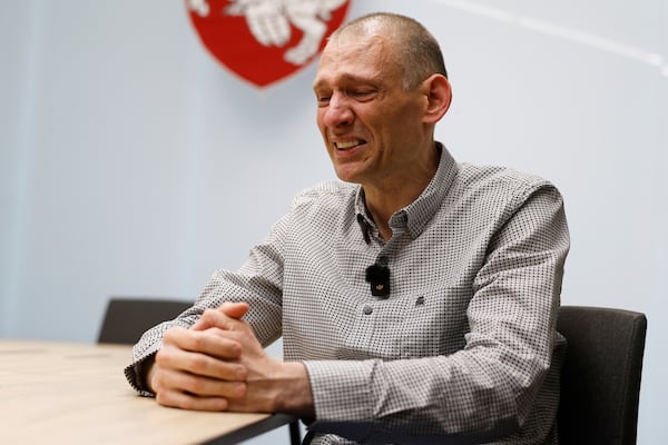 Syarhei Tsikhanouski, a Belarusian opposition activist released from a prison by Belarusian authorities, cries during an interview with the Associated Press in Vilnius, Lithuania, Sunday, June 22, 2025. (AP Photo/Mindaugas Kulbis)