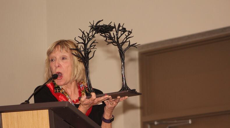 Patti Garrett was appointed Decatur mayor for the fourth consecutive one-year term Monday night. She is shown here several weeks ago displaying a miniature replica of a sculpture entitled “Start Where You Are,” honoring longtime City Manager Peggy Merriss who recently retired. When finished the sculpture will reside in Legacy Park. Courtesy of Greg White