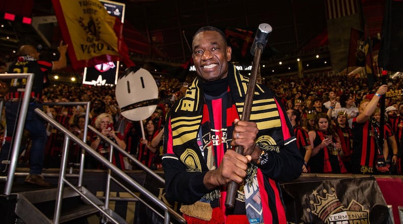 Former Hawks player Dikembe Mutombo performs the Golden Spike tradition at an Atlanta United game. (Photo contributed by Atlanta United)
