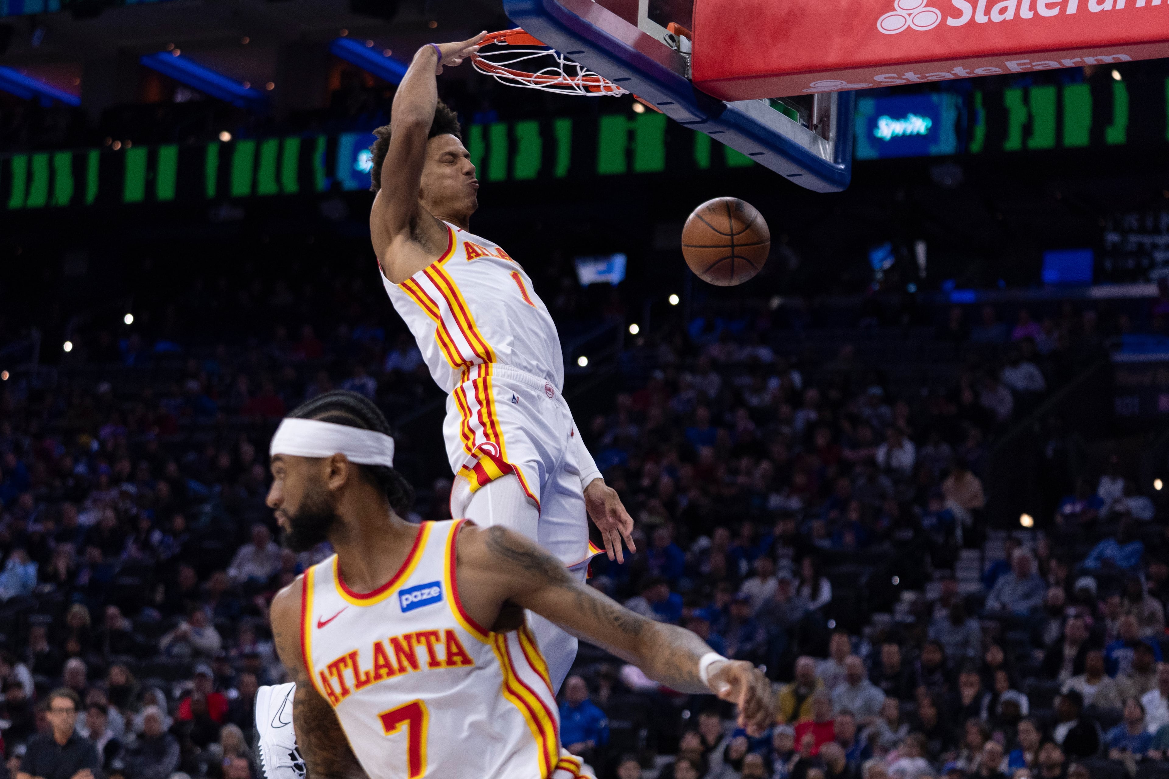 Hawks forward Jalen Johnson dunks the ball from the pass by Nickeil Alexander-Walker during the first half of their game against the 76ers on Sunday, Nov. 30, 2025, in Philadelphia. (Chris Szagola/AP)