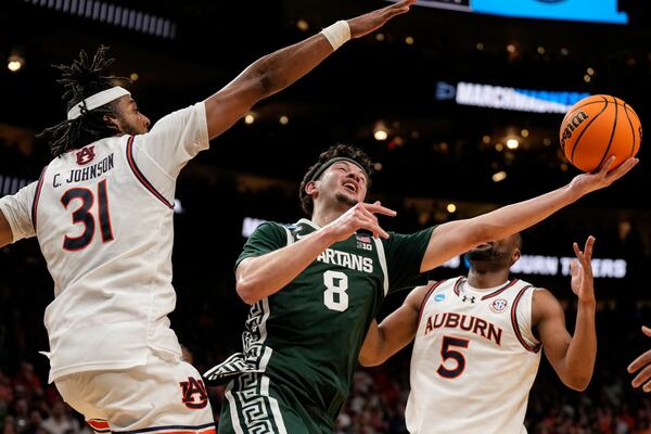 Michigan State forward Frankie Fidler (8) shoots against Auburn forward Chaney Johnson (31) during the second half in the Elite Eight of the NCAA college basketball tournament, Sunday, March 30, 2025, in Atlanta. (AP Photo/George Walker IV)