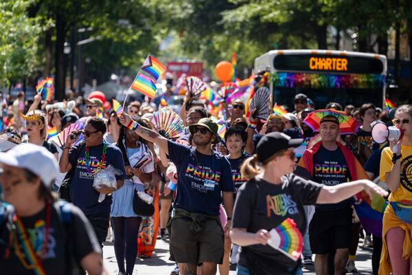 Andres Castro (center) marches with Emory Healthcare during the 2025 Pride parade in Atlanta. (Ben Gray for the AJC)
