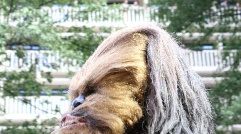 Chewbacca has always had a presence at Dragon Con, such as when this costumed version paraded down Peachtree Street for the 10th anniversary Dragon Con parade in 2011. The convention has announced that the real Chewbacca -- actor Peter Mayhew -- will appear over Labor Day weekend. CONTRIBUTED BY MIKKI K. HARRIS