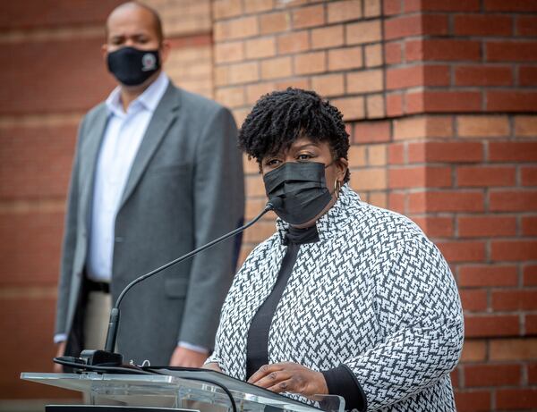 Atlanta Public Schools Superintendent Lisa Herring talks at a news conference at M. Agnes Jones Elementary School in Atlanta on Monday as school board Chairman Jason Esteves looks on.  STEVE SCHAEFER FOR THE ATLANTA JOURNAL-CONSTITUTION