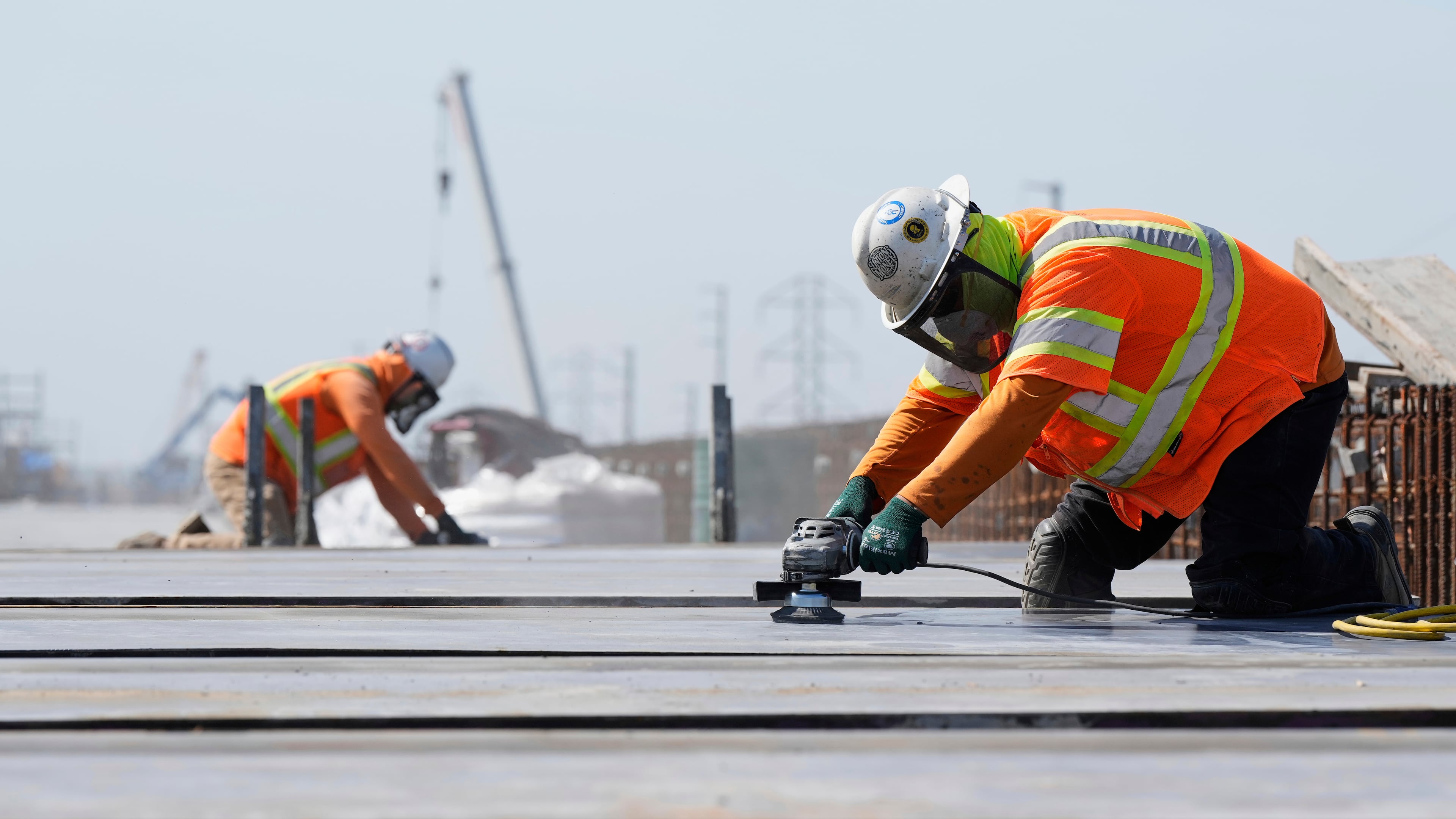 FILE - Ironworkers with the California High-Speed Rail Authority work on the Hanford Viaduct, April 15, 2025, in Kings County, Calif. (AP Photo/Godofredo A. Vásquez, File)