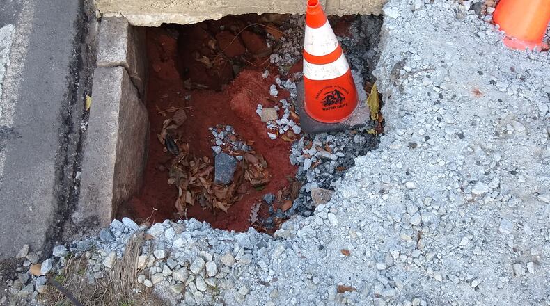 Bill Woolf hopes this sidewalk will soon be repaired. (Photo/Bill Woolf).