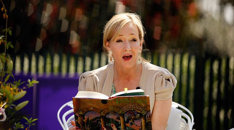 WASHINGTON - APRIL 05: British author J.K. Rowling, creator of the Harry Potter fantasy series, points to the place on her forehead where her title character has a scar while reading "Harry Potter and the Sorcerer's Stone" during the Easter Egg Roll on the South Lawn of the White House April 5, 2010 in Washington, DC. About 30,000 people are expected to attend attended the 132-year-old tradition of rolling colored eggs down the South Lawn of the White House. (Photo by Chip Somodevilla/Getty Images)