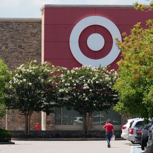 FILE - A person walks towards a Target store, July 15, 2025, in Nashville, Tenn. (AP Photo/George Walker IV, File)