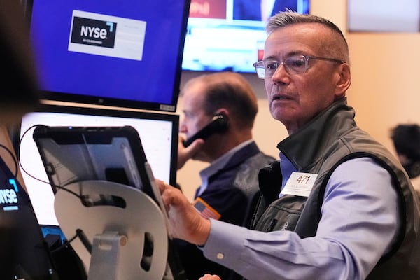 Trader Neil Catania works on the floor of the New York Stock Exchange, Tuesday, July 1, 2025. (AP Photo/Richard Drew)