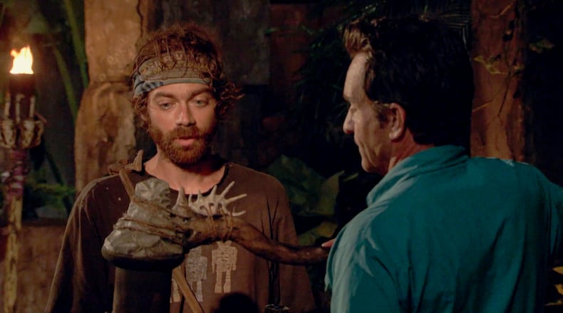 Christian Hubicki, a former post-doc student at Georgia Tech, watches his flame get snuffed out by Jeff Probst during the 13th episode of the 37th season of "Survivor." CREDIT: CBS
