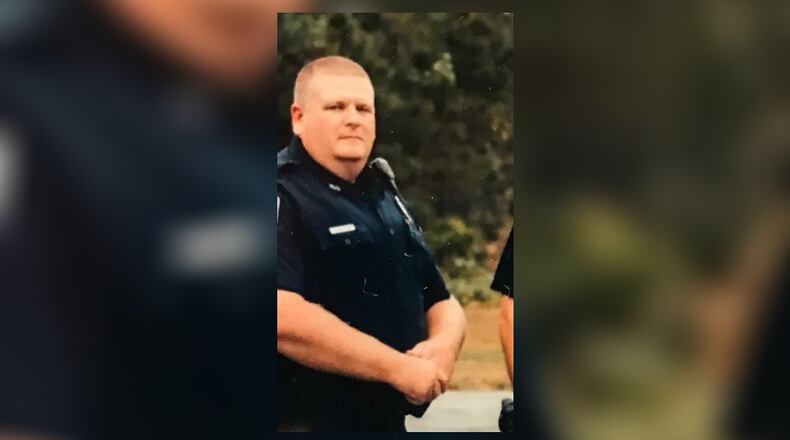 Polk County police Officer Andy Anderson was struck by a train Tuesday while chasing a burglary suspect on a railroad track in Rockmart.