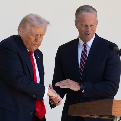 President Donald Trump shakes hands with Senate Majority Leader John Thune, R-S.D., right, during a lunch with Republican Senators on the Rose Garden patio at the White House, Tuesday, Oct. 21, 2025, in Washington. (AP Photo/Manuel Balce Ceneta)